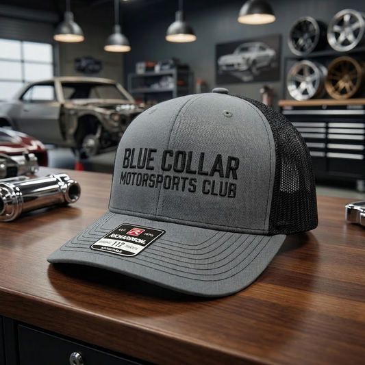 BCMC Trucker Cap — Black Logo, front view on adjustable snapback mesh trucker
